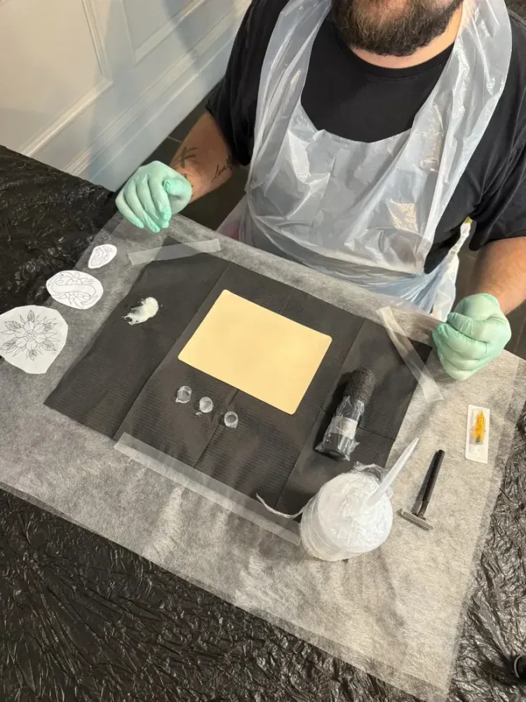 A complete beginner learning to tattoo on real skin